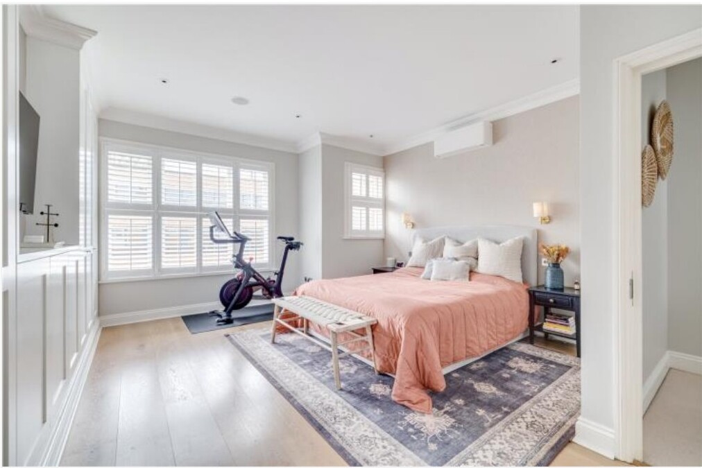 Light-filled bedroom with large windows