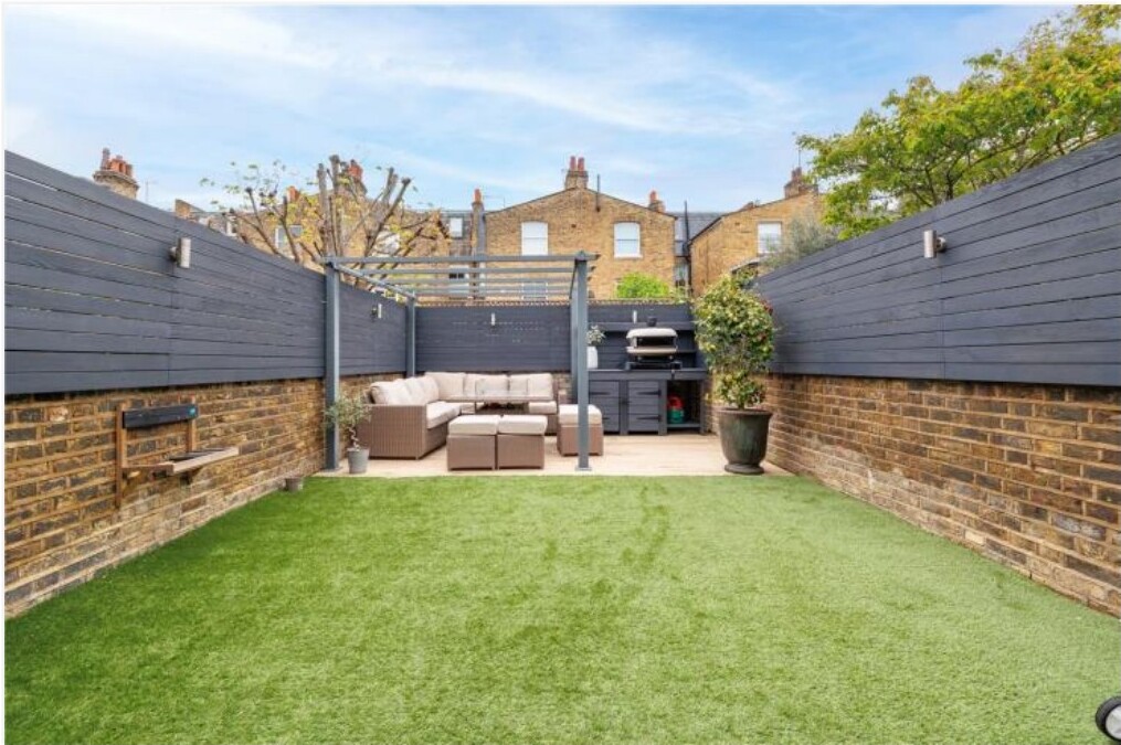 Especially large rear garden with patio