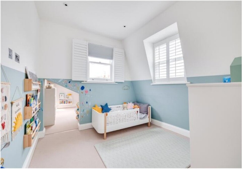 Children's playroom with blue walls and shutters